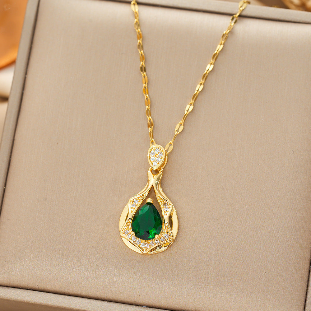 Ketting met bladhanger met groene steen in goudkleur