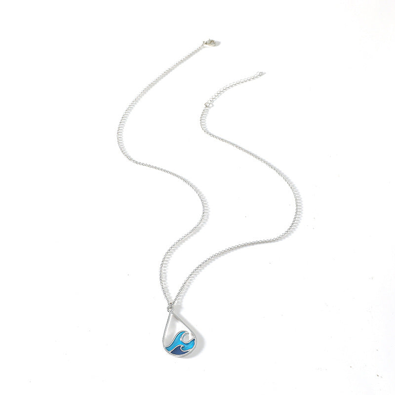 Zilverkleurige ketting met turquoise bedel