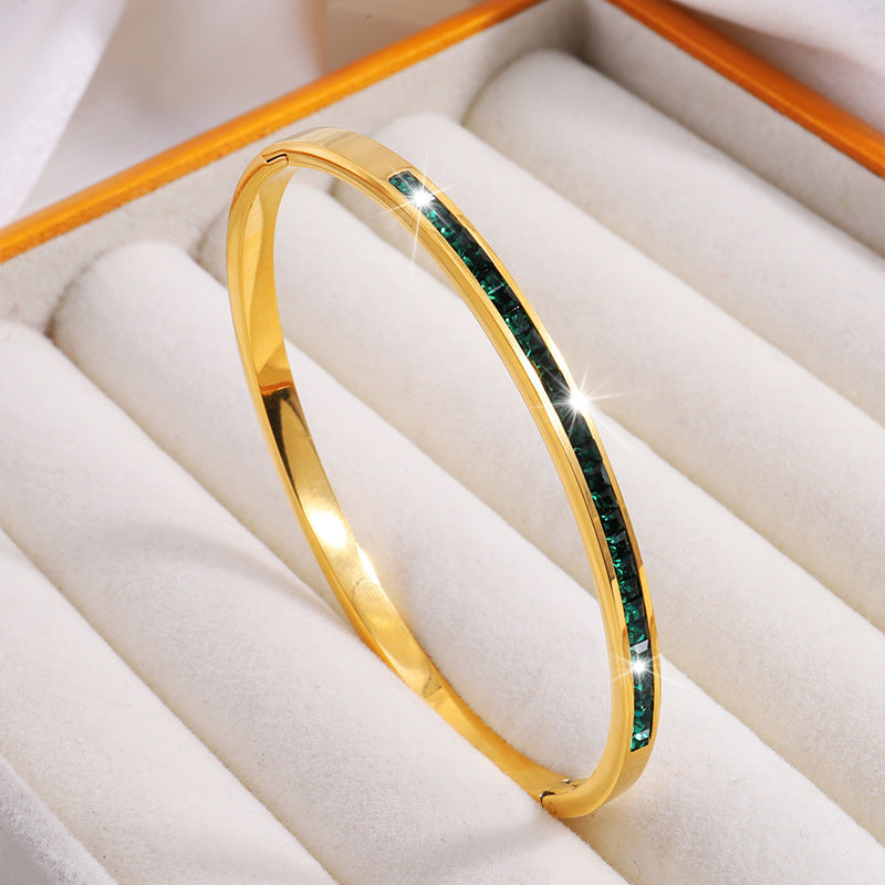 Gold-Tone Bangle with Green Stone Accents