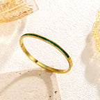 Gold-Tone Bangle with Green Stone Accents