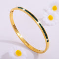 Gold-Tone Bangle with Green Stone Accents