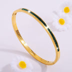 Gold-Tone Bangle with Green Stone Accents