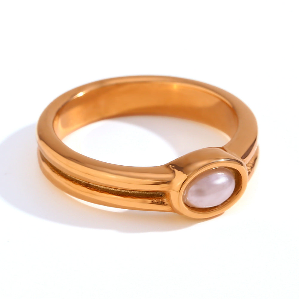 Goudkleurige bandring met groef en ovale parellook-inleg