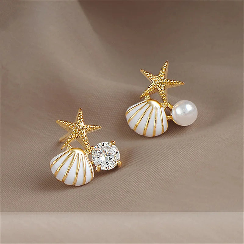 Zeesteroorbellen met schelp- of pareldetail