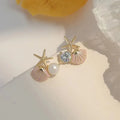 Zeesteroorbellen met schelp- of pareldetail