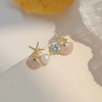 Zeesteroorbellen met schelp- of pareldetail