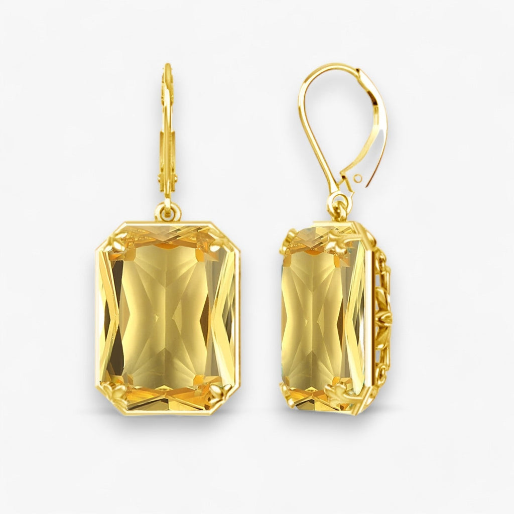 Oorhangers met blauwe steen in goud- en zilverkleur