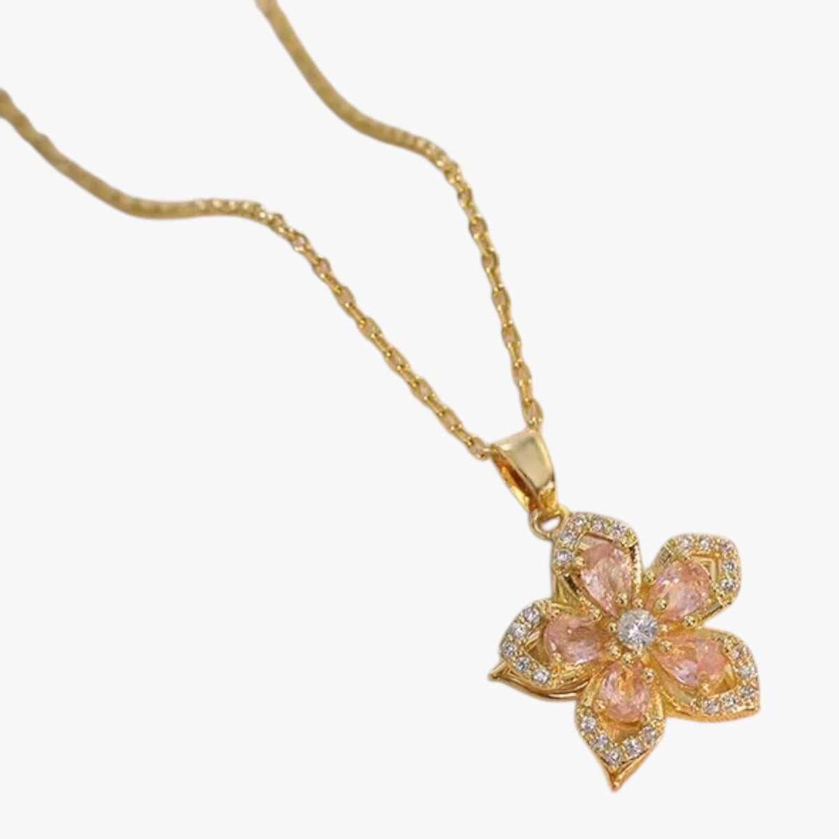 Goudkleurige ketting met ring en draaiende zirkonia bloem