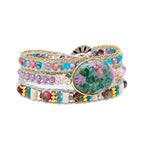 Kralenarmband van blauw calciet en agaat in regenboogkleuren