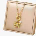 Ketting met bloemhanger en blauwe zirkoniastenen