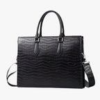 High-Capacity Black Leather Travel Bag with Laptop Compartment