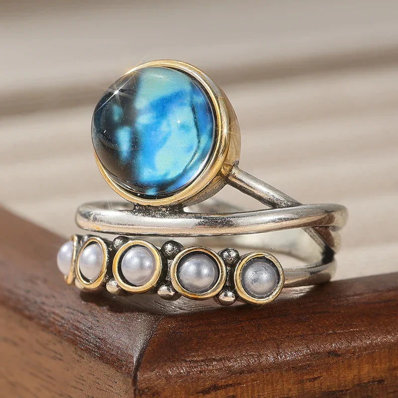 Stapelring met blauwe abalone en parel
