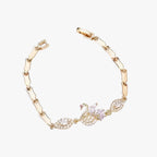 Goudkleurige armband met zwaandetail in zirkoon