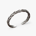 Gedraaide geweven armband in zilverkleur