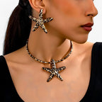 Set met zeesterketting en oorbellen in luipaardprint