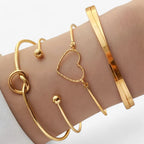 Set ineengevlochten stalen armbanden, goudkleurig