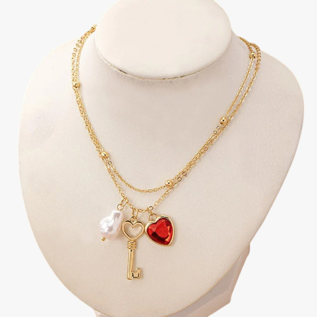 Ketting met harthanger en enkele parelhanger