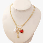 Ketting met harthanger en enkele parelhanger