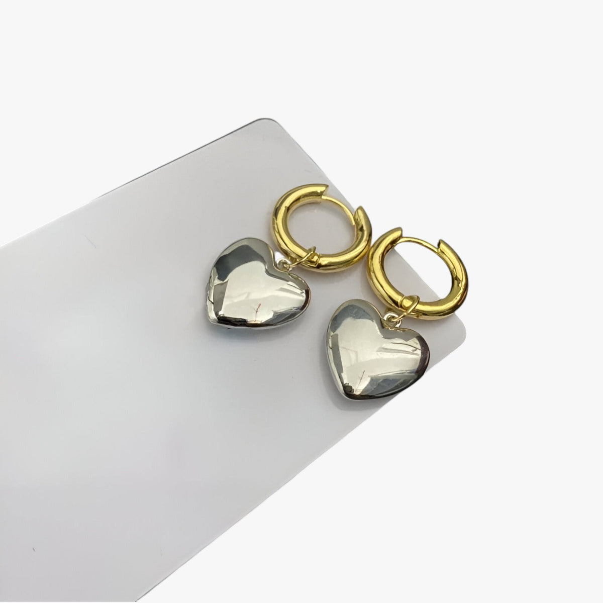 Tweekleurige hartoorbellen in goud en zilver