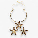 Set met zeesterketting en oorbellen in luipaardprint