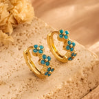 Oorringen met turquoise bloem