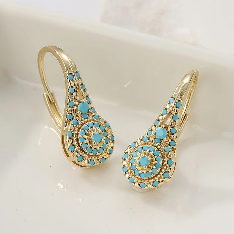 Vergulde turquoise bloesemoorbellen