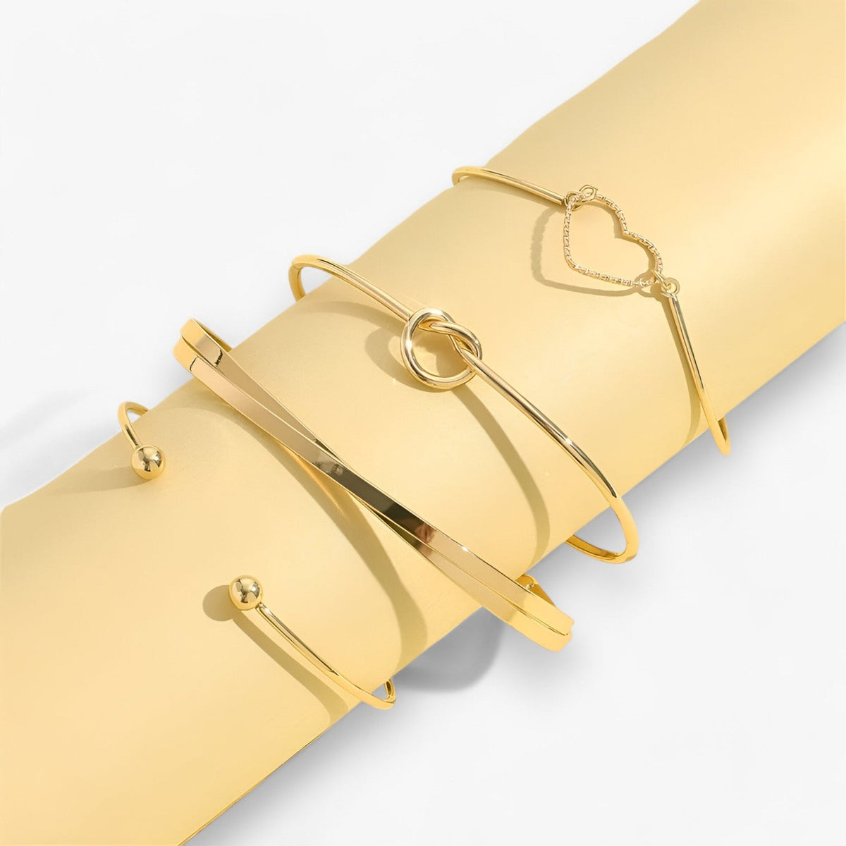 Set ineengevlochten stalen armbanden, goudkleurig