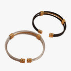 Tweekleurige armband met gevlochten touwpatroon
