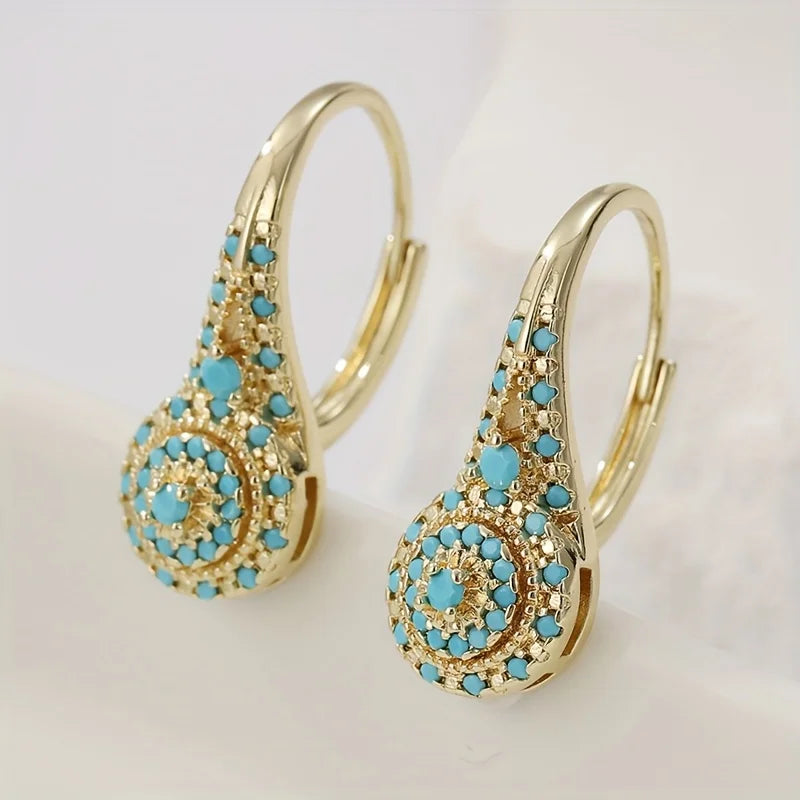 Vergulde turquoise bloesemoorbellen