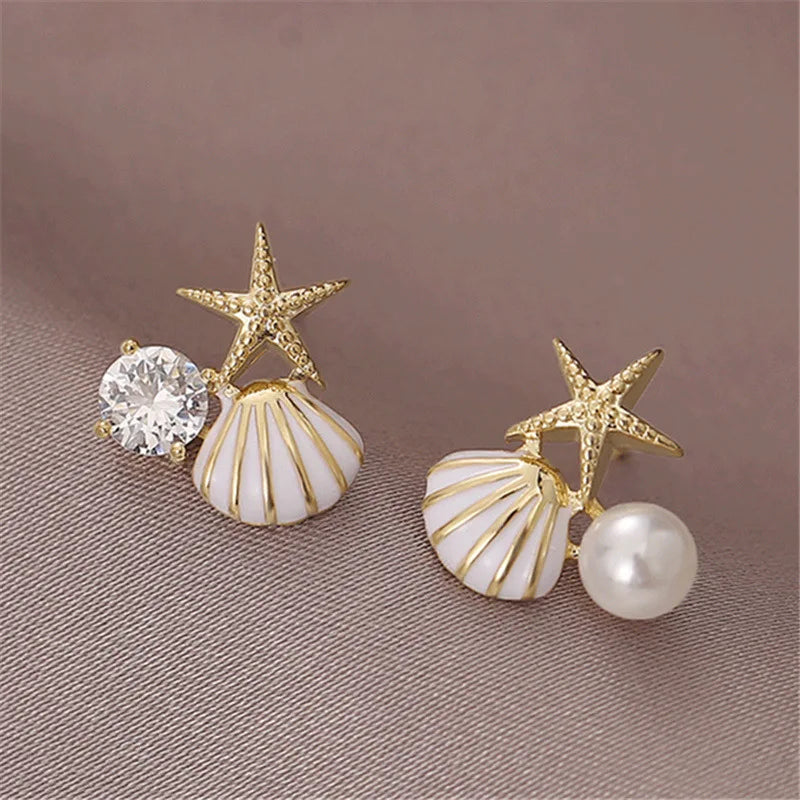 Zeesteroorbellen met schelp- of pareldetail