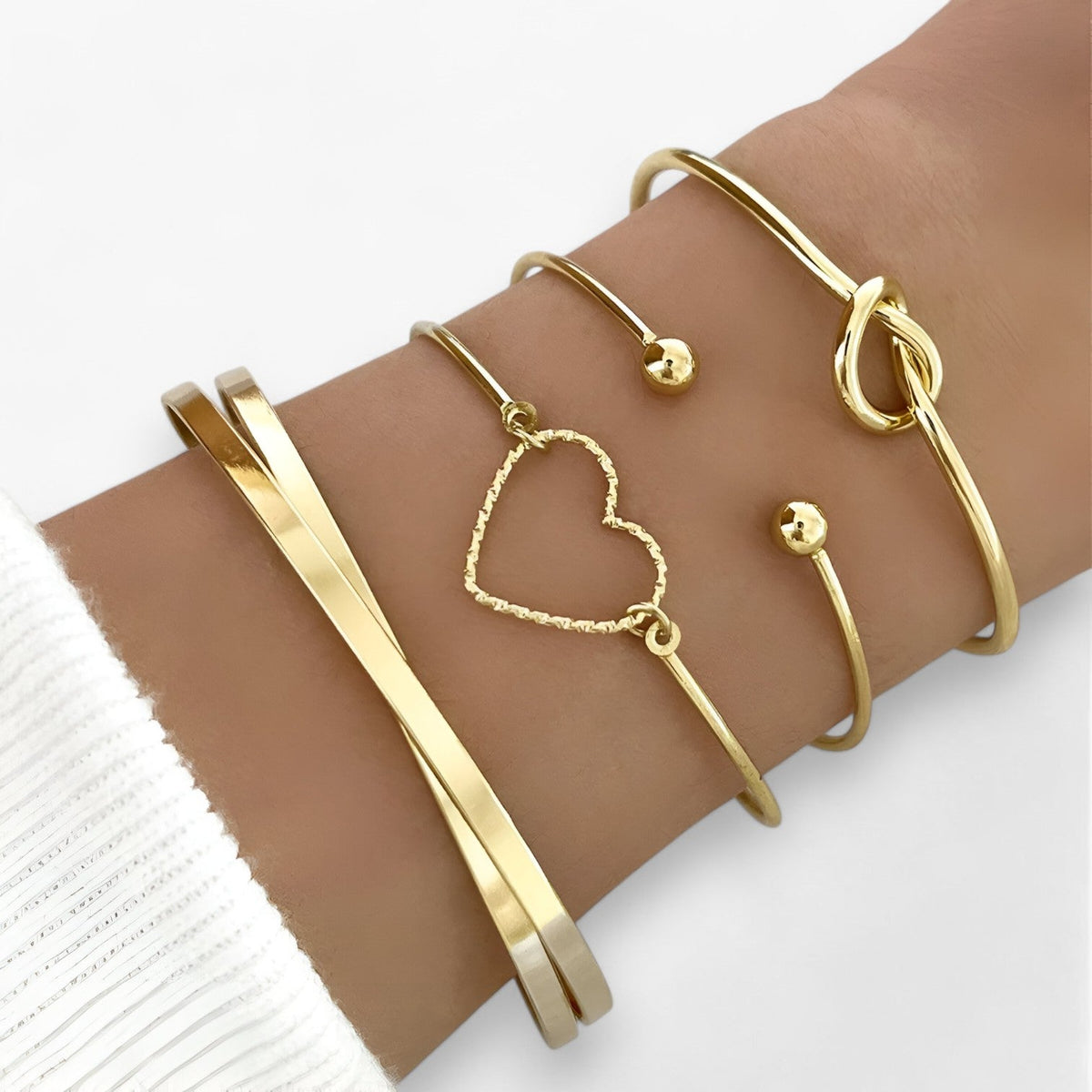 Set ineengevlochten stalen armbanden, goudkleurig