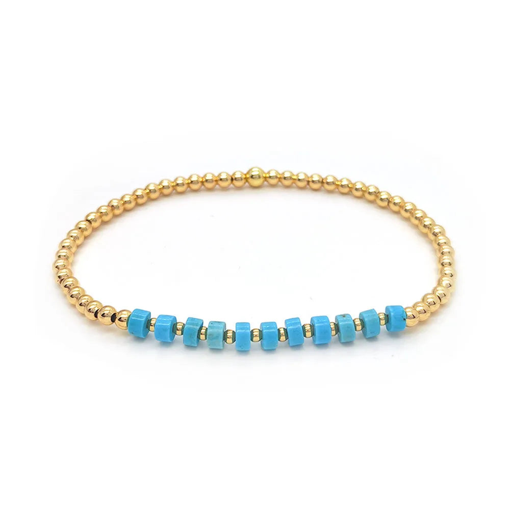 Turquoise kralenarmband met kruisbedel in vintagestijl
