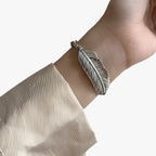 Sterling Silver Bracelet with Gold-Tone Feather Charm