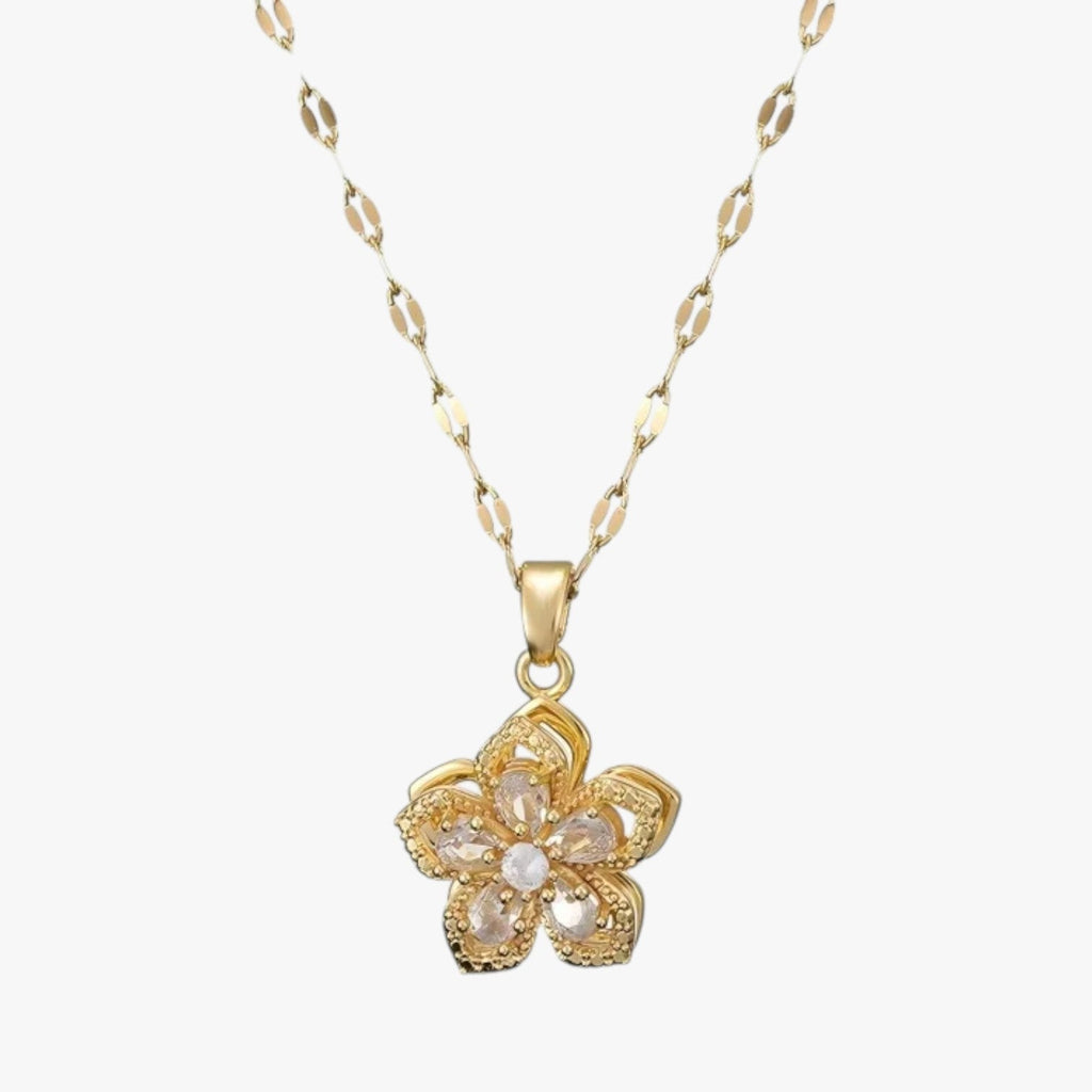 Goudkleurige ketting met ring en draaiende zirkonia bloem