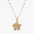 Goudkleurige ketting met ring en draaiende zirkonia bloem