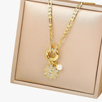 Ketting met bloemhanger en blauwe zirkoniastenen