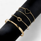Set ineengevlochten stalen armbanden, goudkleurig