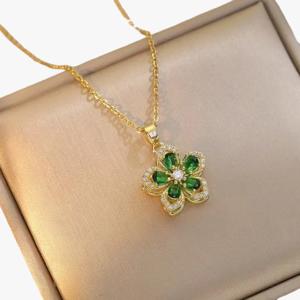 Goudkleurige ketting met ring en draaiende zirkonia bloem