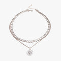 Gelaagde muntketting met oplopende kettinglengtes