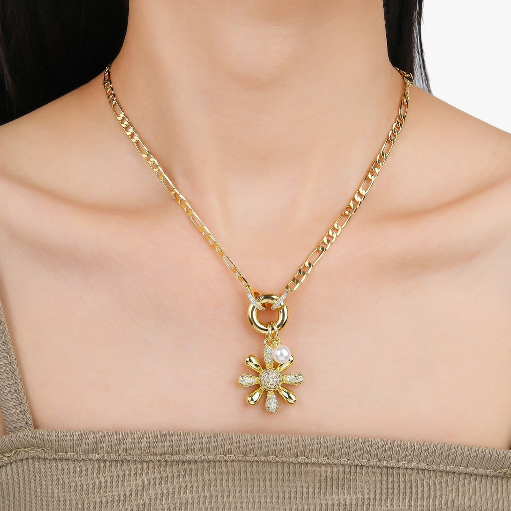 Ketting met bloemhanger en blauwe zirkoniastenen