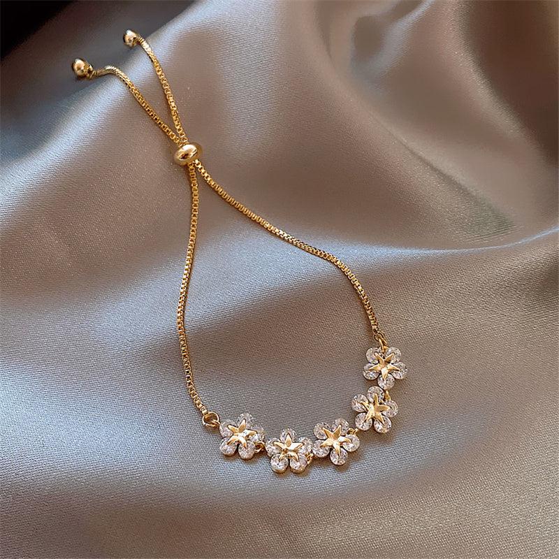 Kristallen madeliefjesarmband in goudkleur