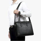High-Capacity Black Leather Travel Bag with Laptop Compartment