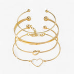 Set ineengevlochten stalen armbanden, goudkleurig
