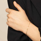 Fijne goudkleurige schakelarmband