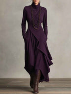Gedrapeerde asymmetrische maxi-jurk met hoge hals en lange mouwen
