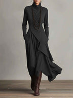 Gedrapeerde asymmetrische maxi-jurk met hoge hals en lange mouwen