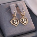 Fijne oorringen met initiaal en hart