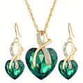 Set met ketting en oorbellen met groen kristallen hart en krul
