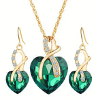 Set met ketting en oorbellen met groen kristallen hart en krul