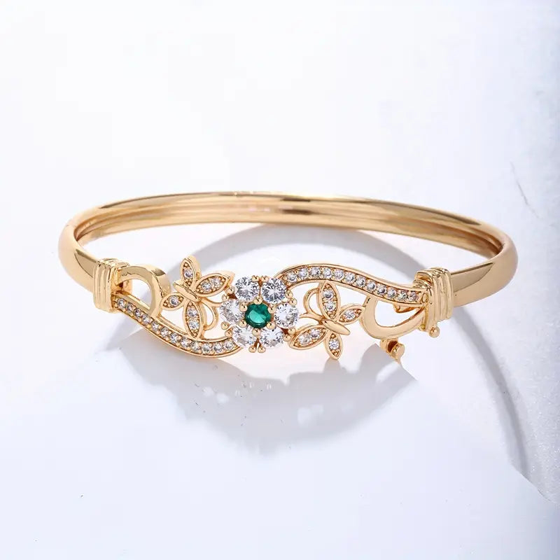 Goudkleurige bangle met middensteen